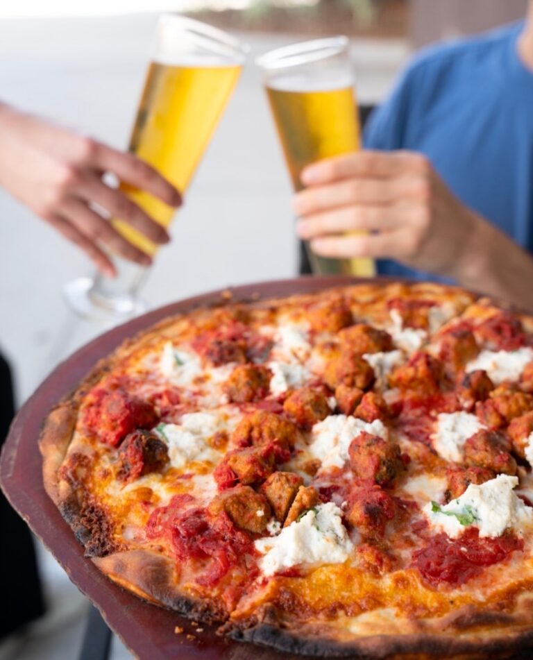 Coal-fired pepperoni pizza paired with craft beer at Anthony’s for National Beer Day celebration.