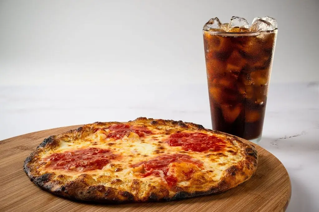 A classic cheese pizza served with a cold Coke, perfect for a casual meal.