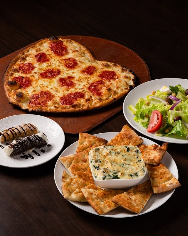 Coal-fired margherita pizza with fresh basil, garden salad, and rich cheesecake at Anthony’s for Mother’s Day.