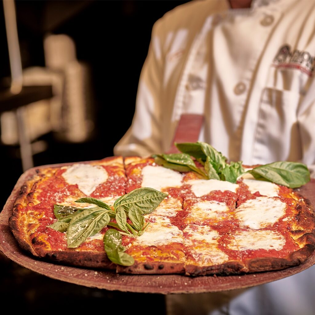 Square Margherita pizza from Anthony’s, topped with fresh mozzarella, tomato sauce, and basil.